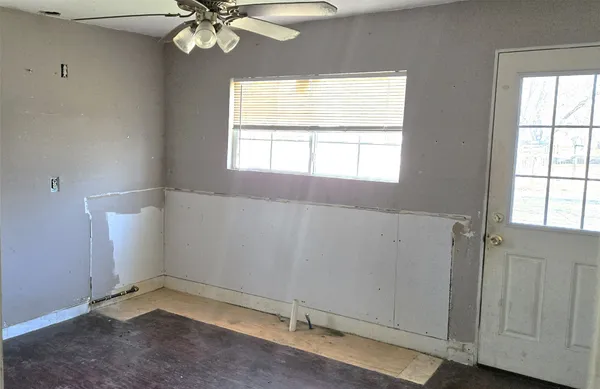 a view of an empty room with a window