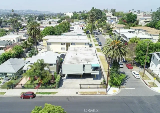 an aerial view of a house with a garden and plants
