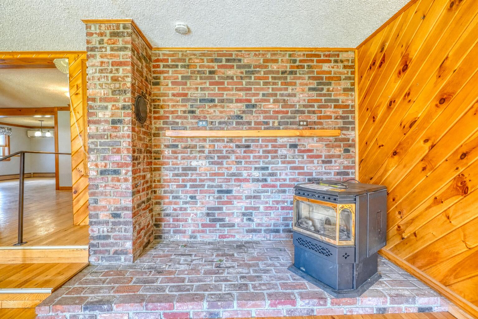 28 Belgrade Road Oakland, ME 04963 - Photo 19 of 63 Pellet stove in living room