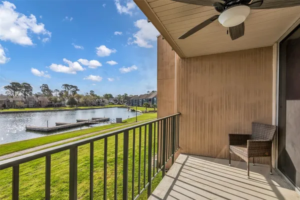 a view of swimming pool outdoor seating and lake view