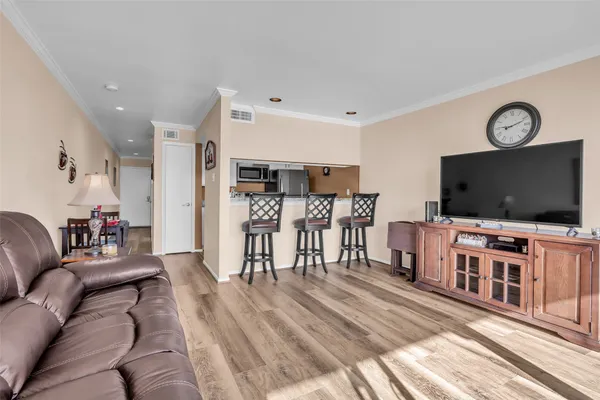 a kitchen with stainless steel appliances granite countertop a sink stove and microwave