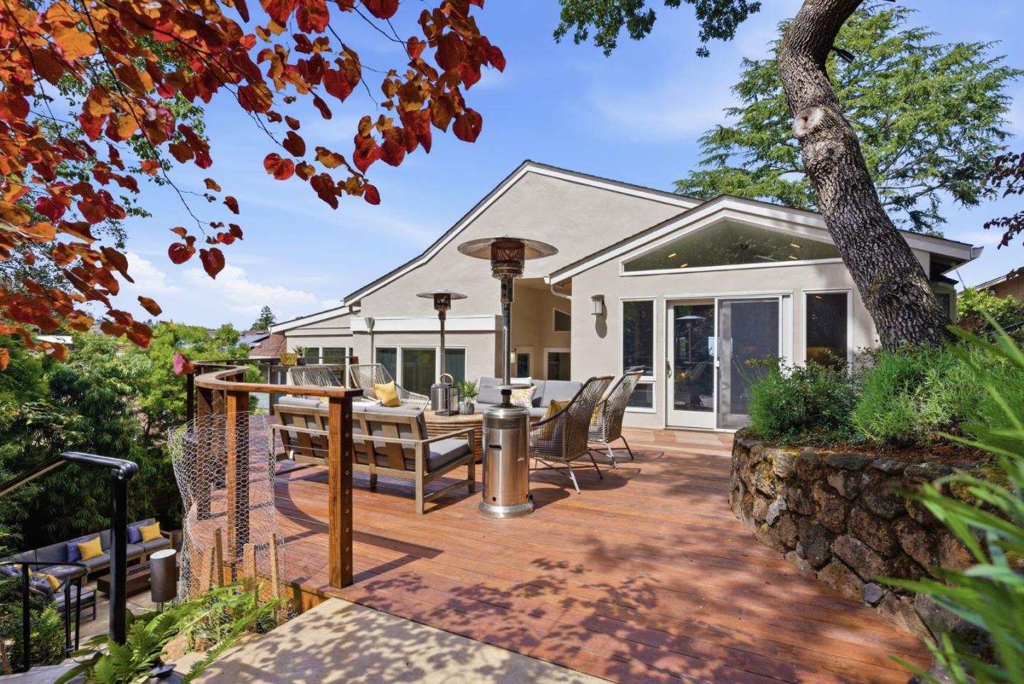 2884 Roland Avenue San Carlos, CA 94070 - Photo 9 of 27 a view of a patio with table and chairs and a large tree