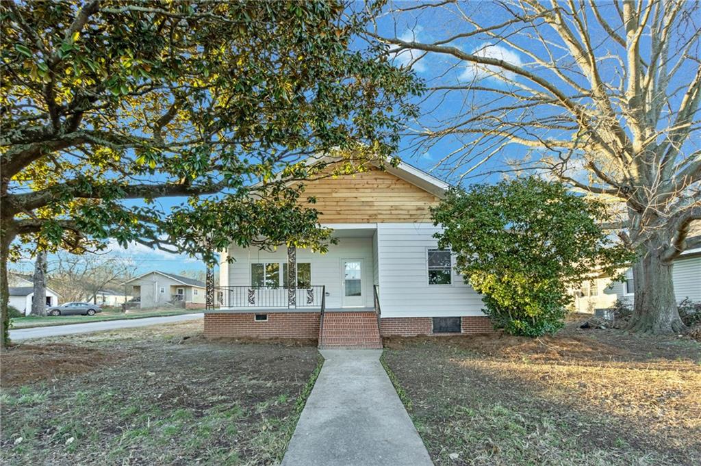 370 1st Street Northeast Rome, GA 30161 - Photo 1 of 1 a view of a house with a yard
