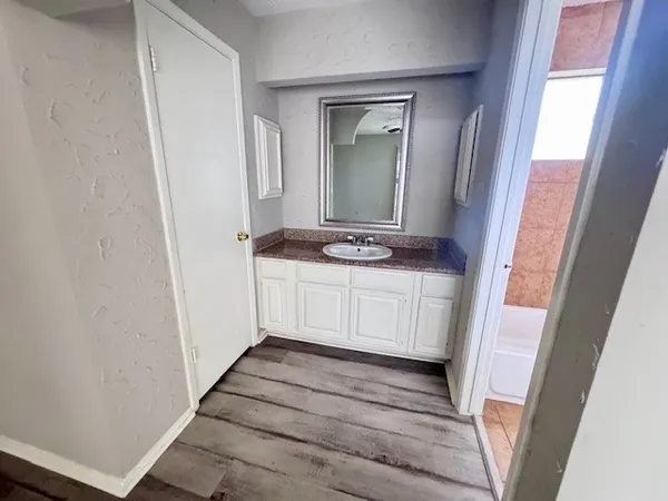 a bathroom with sink and mirror