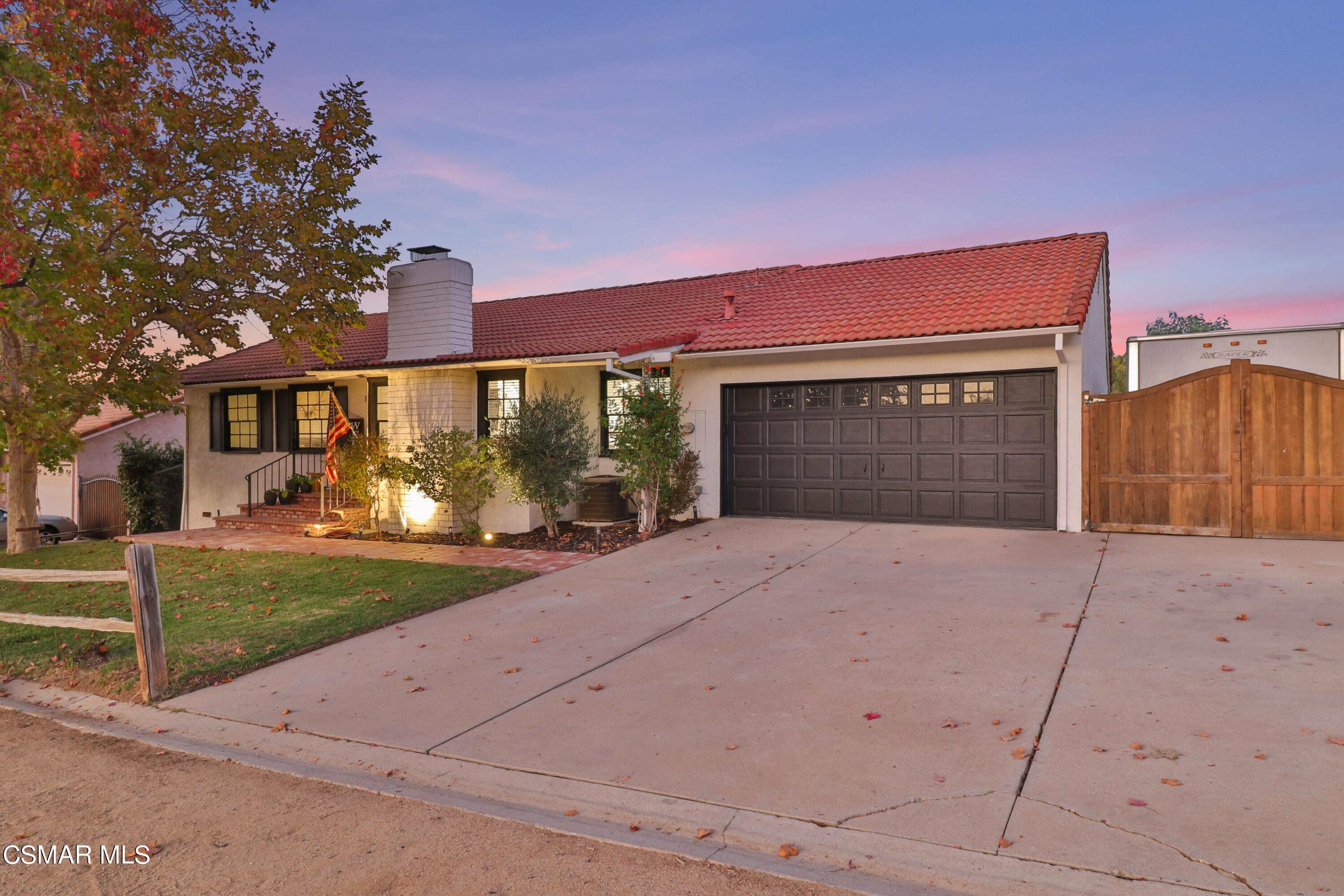 1193 Nonchalant Drive Simi Valley, CA 93065 - Photo 1 of 82 a front view of a house with a yard and garage