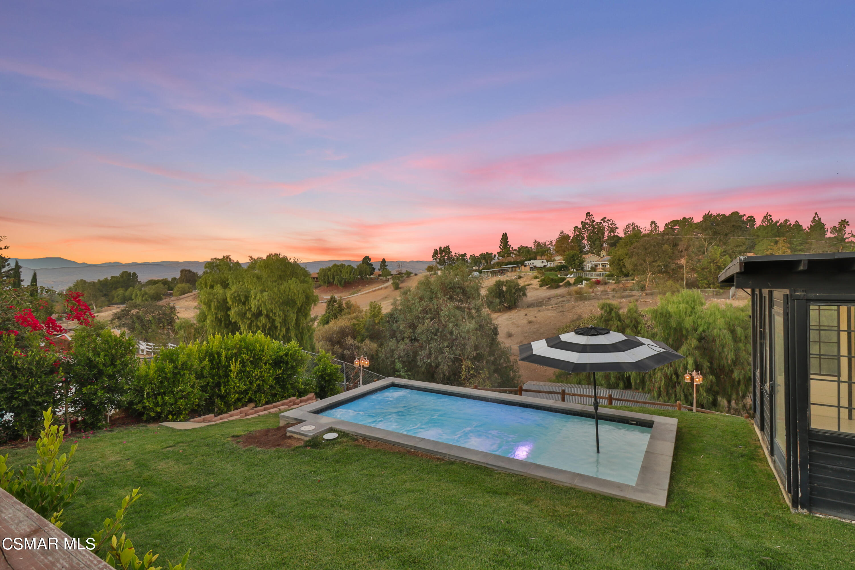 1193 Nonchalant Drive Simi Valley, CA 93065 - Photo 20 of 82 a view of a lake with a mountain in the background