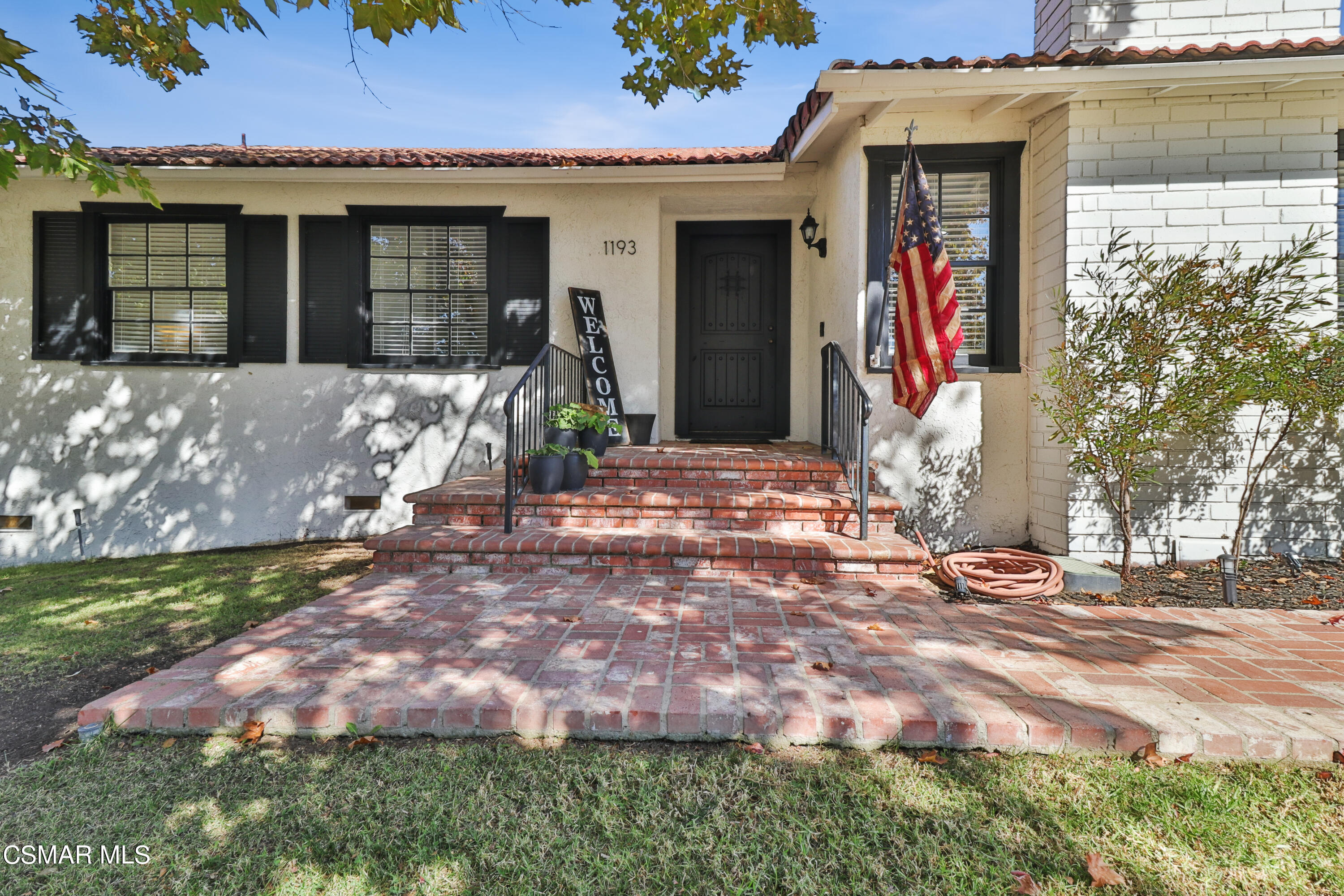 1193 Nonchalant Drive Simi Valley, CA 93065 - Photo 24 of 82 a front view of a house with garden