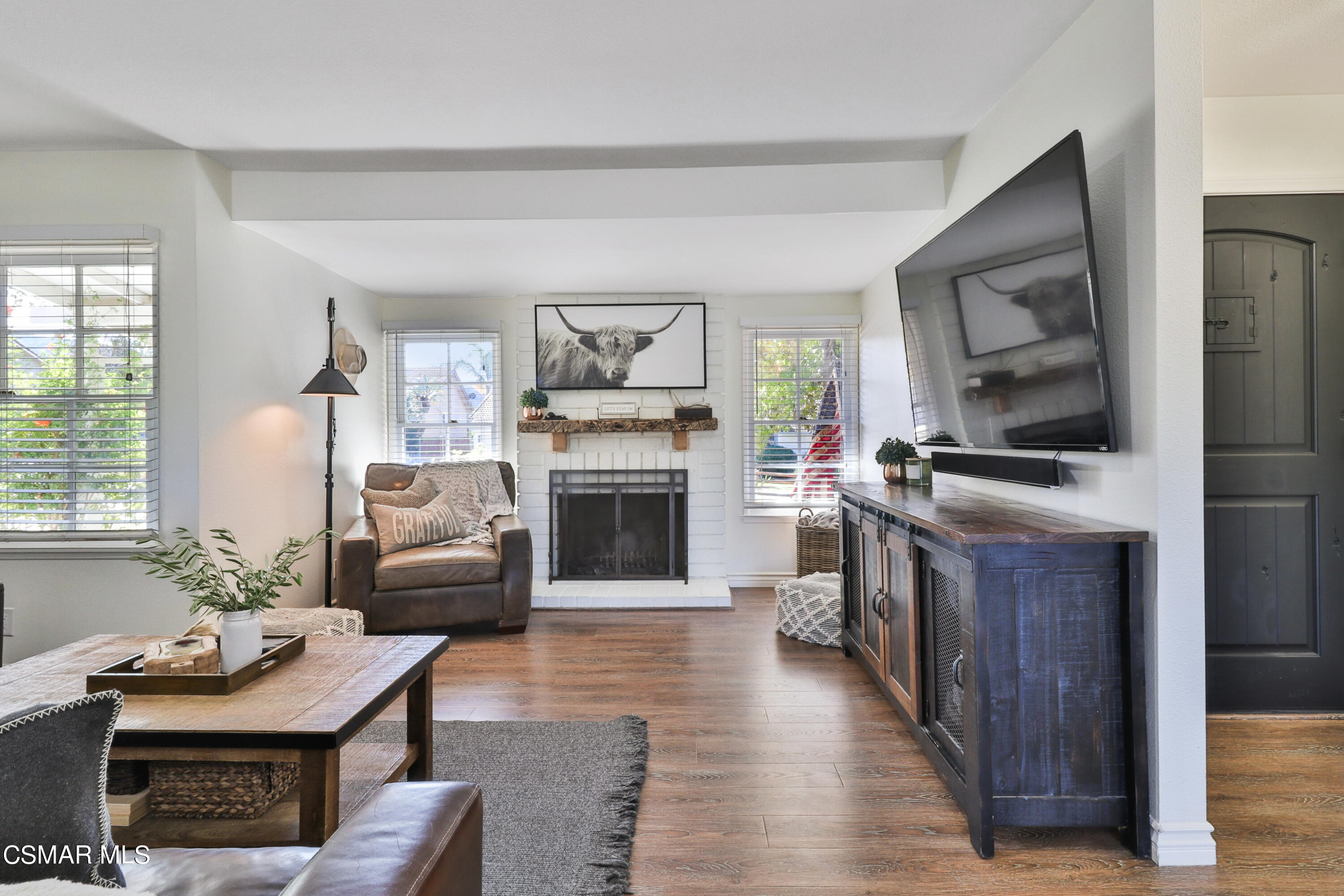 1193 Nonchalant Drive Simi Valley, CA 93065 - Photo 31 of 82 a living room with furniture flat screen tv and a fireplace