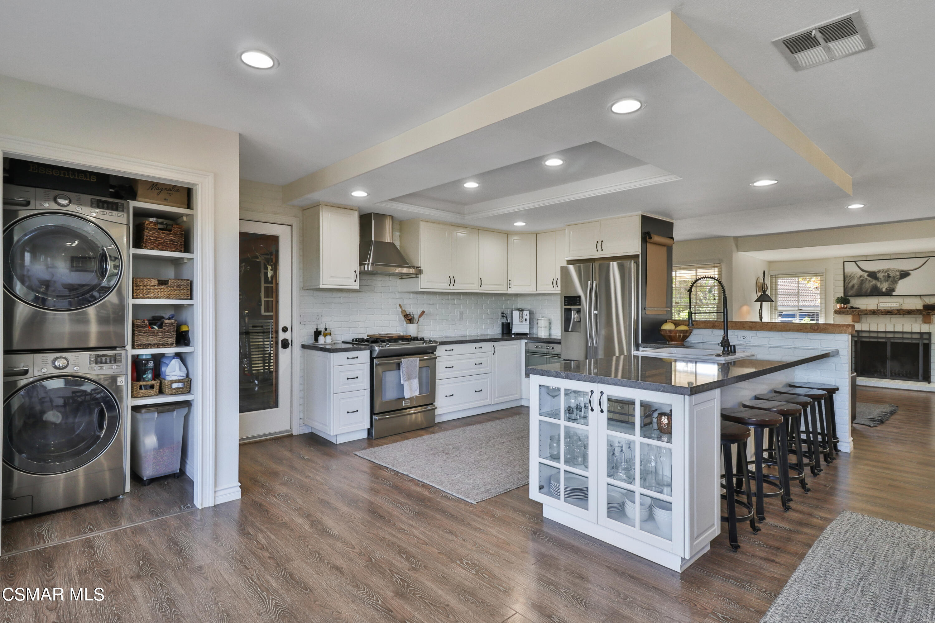 1193 Nonchalant Drive Simi Valley, CA 93065 - Photo 41 of 82 a kitchen with stainless steel appliances a stove a sink a refrigerator and cabinets