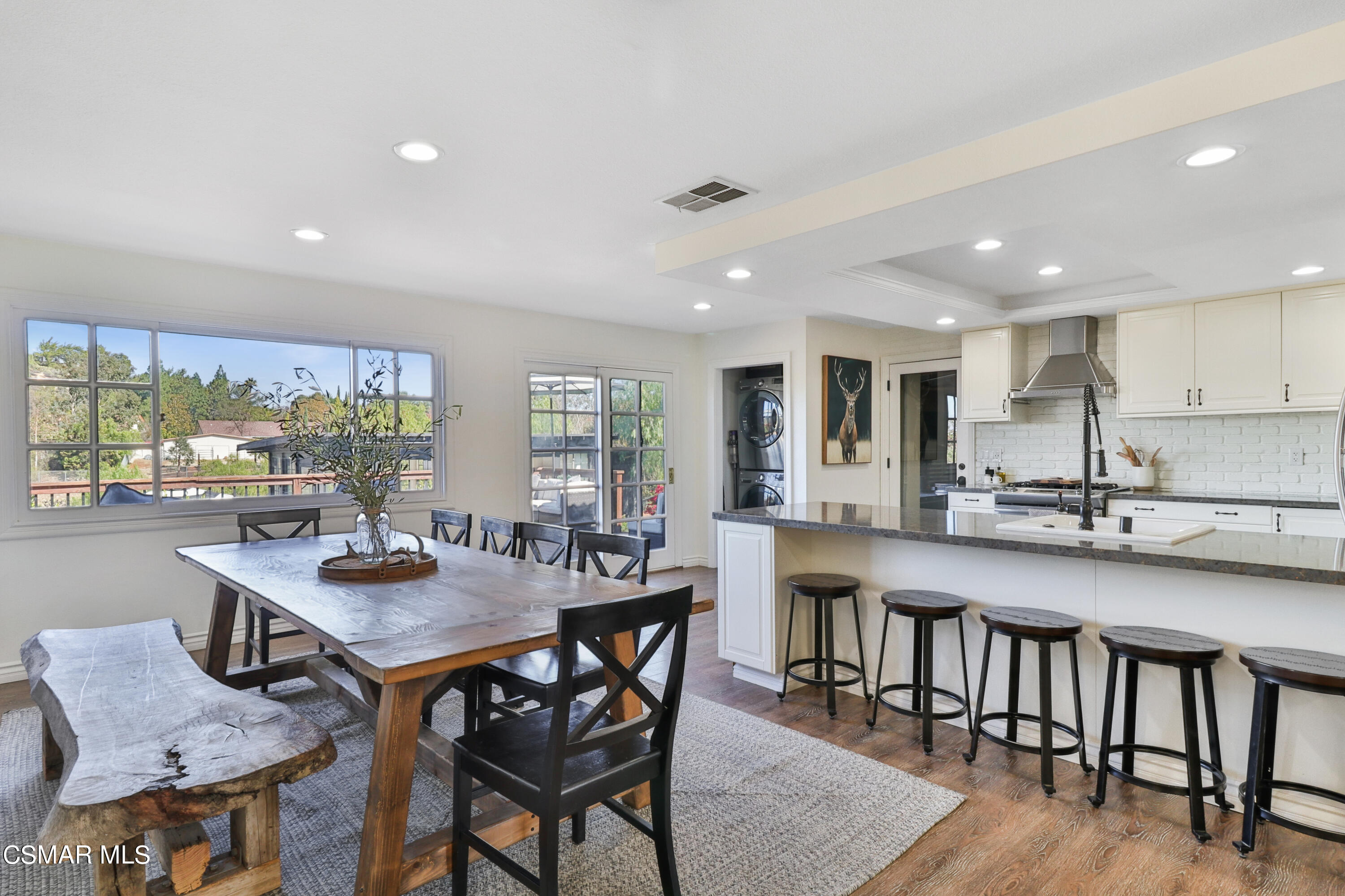 1193 Nonchalant Drive Simi Valley, CA 93065 - Photo 44 of 82 a kitchen with a dining table chairs and window