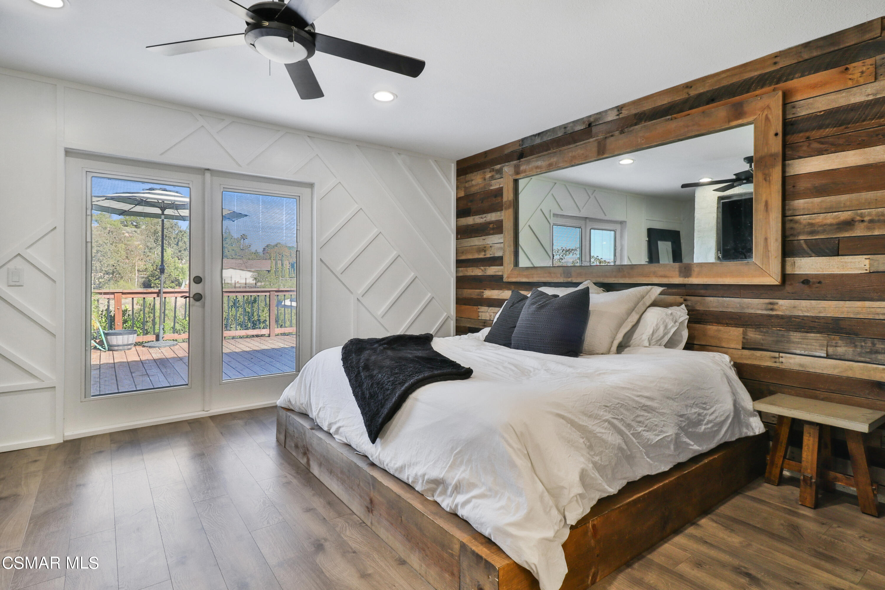 1193 Nonchalant Drive Simi Valley, CA 93065 - Photo 50 of 82 a bedroom with a large bed and wooden floor