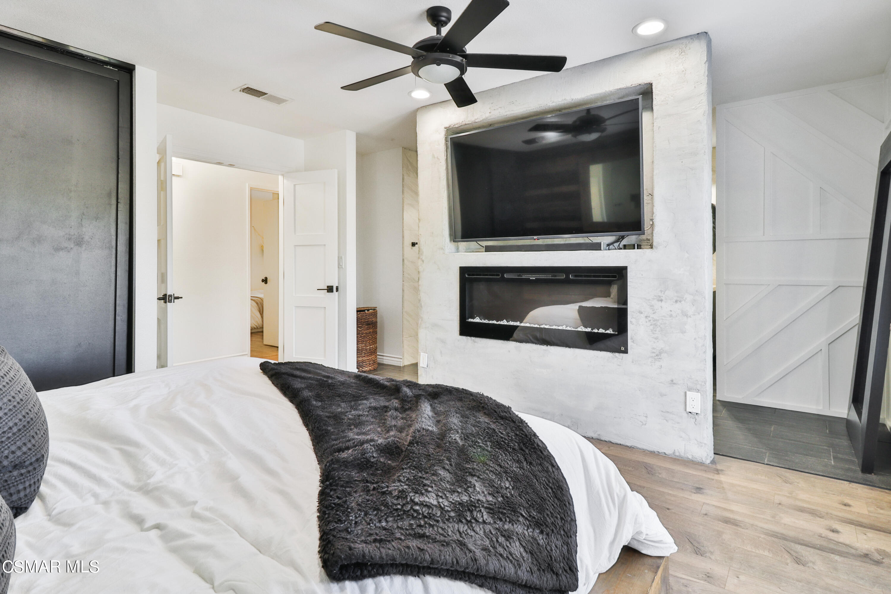 1193 Nonchalant Drive Simi Valley, CA 93065 - Photo 51 of 82 a bedroom with a bed and a fireplace