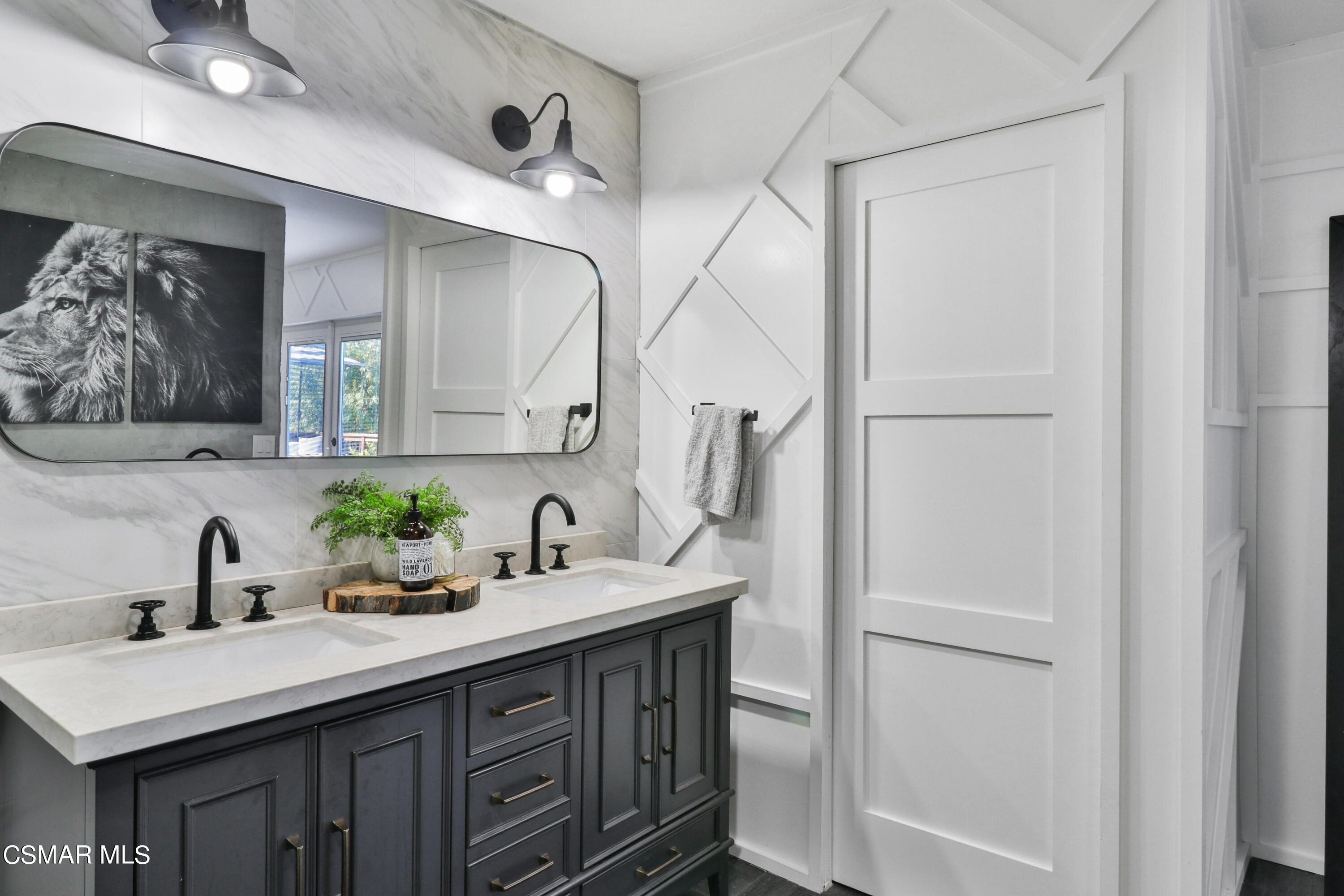 1193 Nonchalant Drive Simi Valley, CA 93065 - Photo 55 of 82 a bathroom with a sink and a mirror