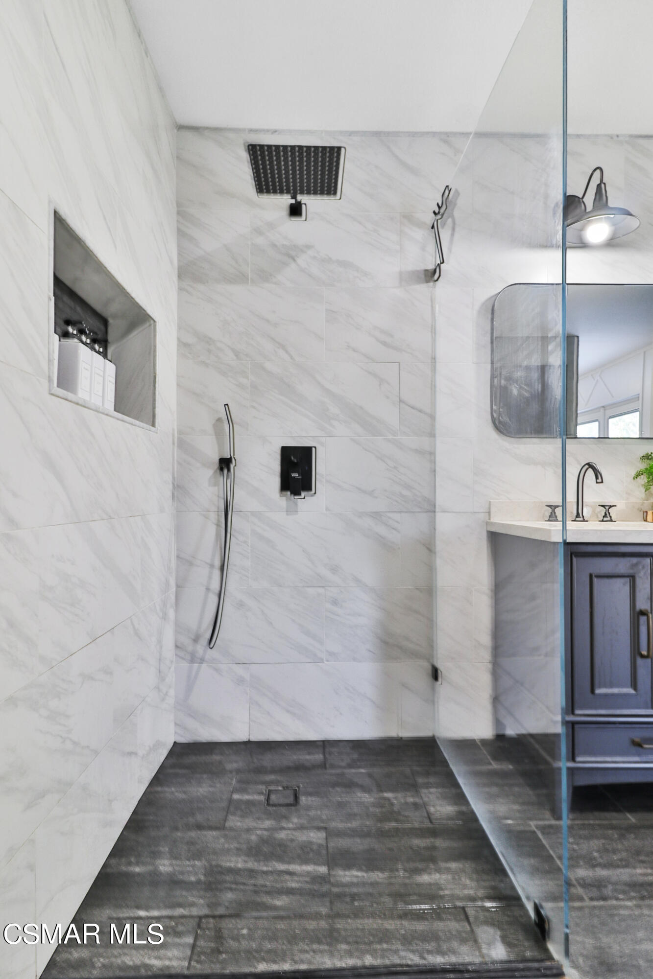 1193 Nonchalant Drive Simi Valley, CA 93065 - Photo 56 of 82 a bathroom with a sink and a mirror