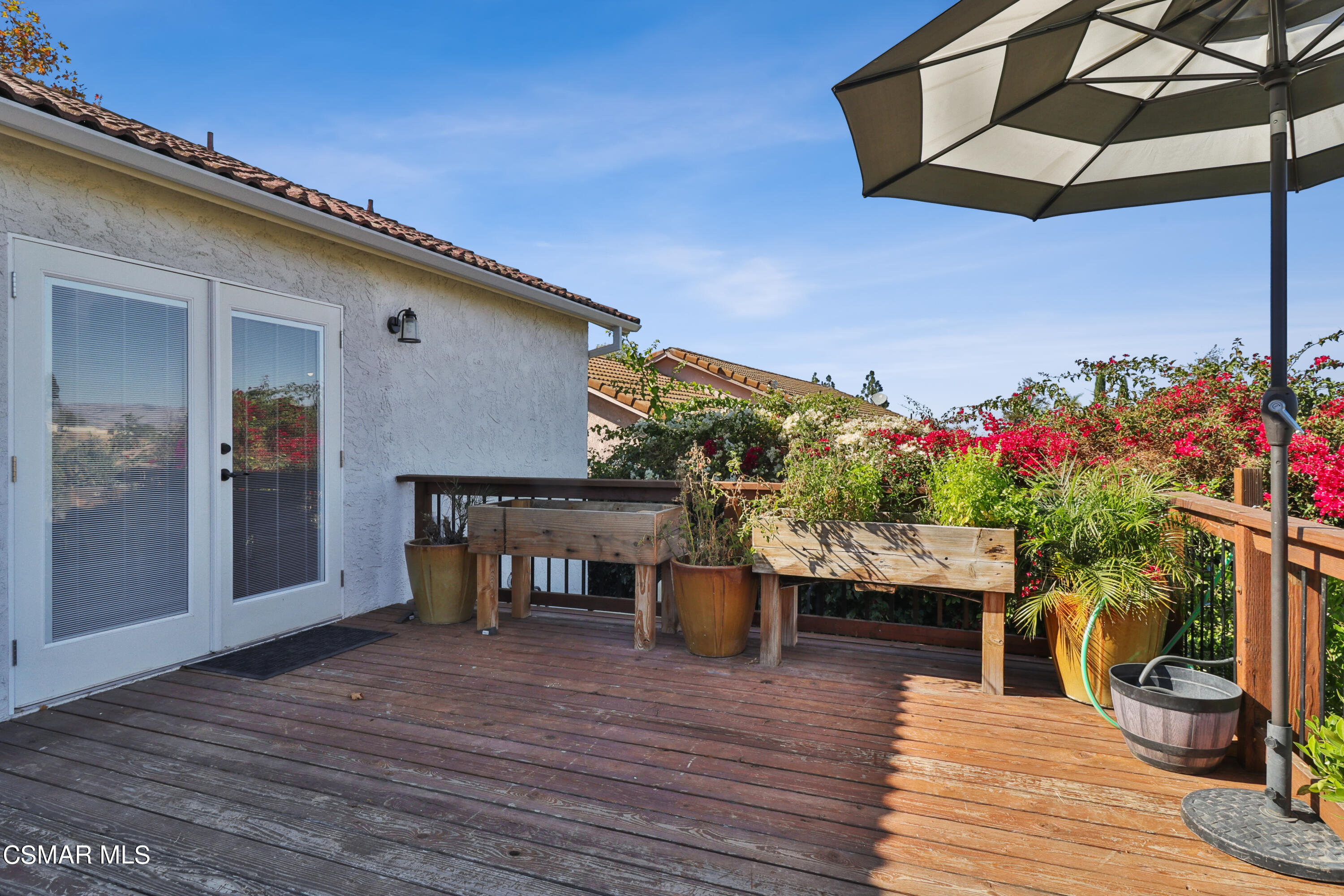 1193 Nonchalant Drive Simi Valley, CA 93065 - Photo 64 of 82 a roof deck view with table and chairs potted plants with wooden floor
