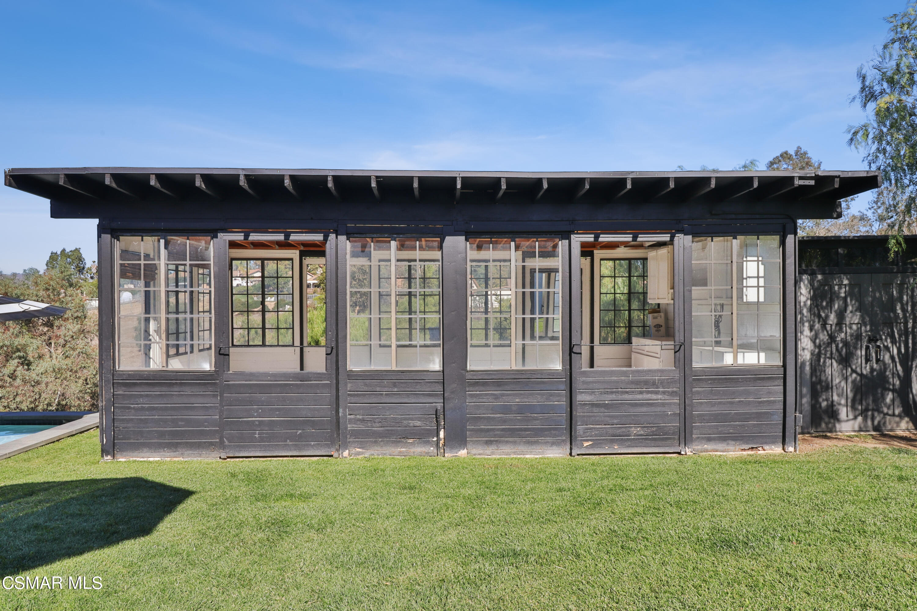 1193 Nonchalant Drive Simi Valley, CA 93065 - Photo 68 of 82 a view of a house with a backyard