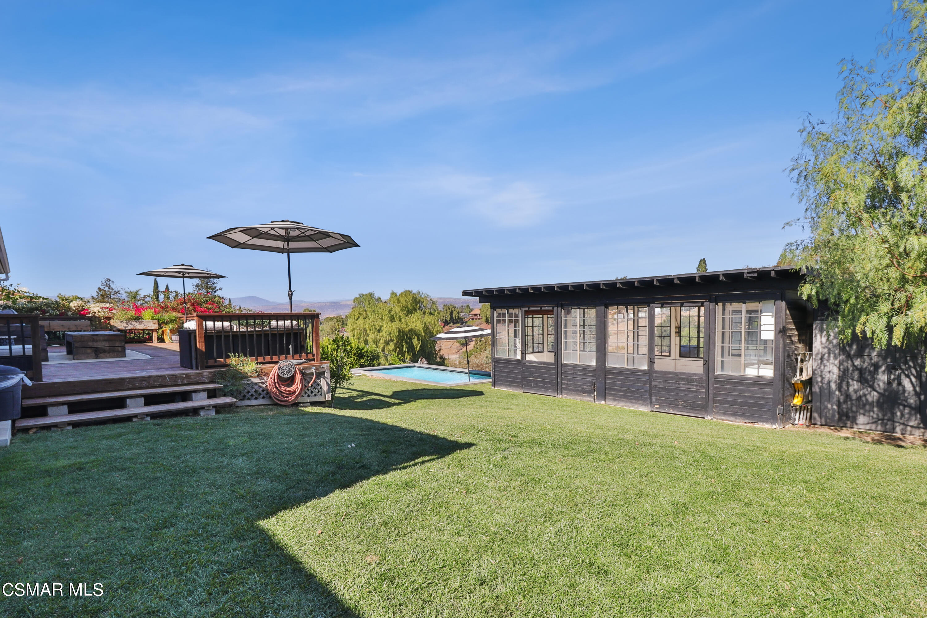 1193 Nonchalant Drive Simi Valley, CA 93065 - Photo 73 of 82 a front view of a house with a yard table and chairs
