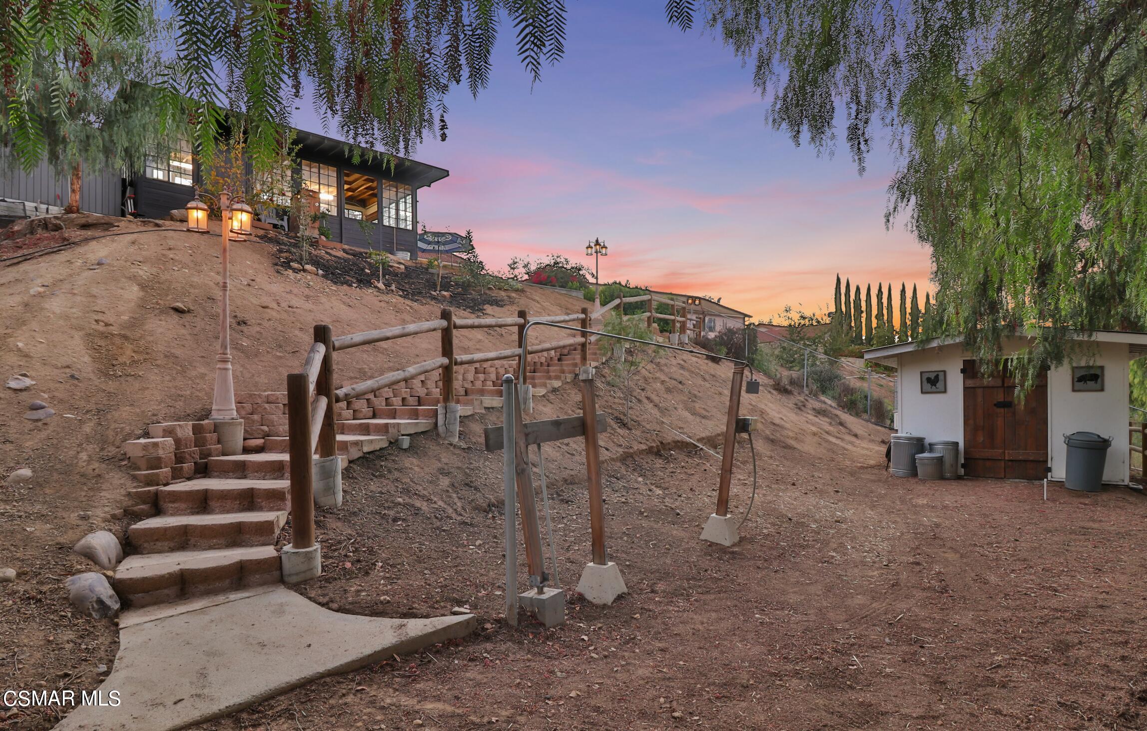 1193 Nonchalant Drive Simi Valley, CA 93065 - Photo 78 of 82 a view of a street with a building in the background