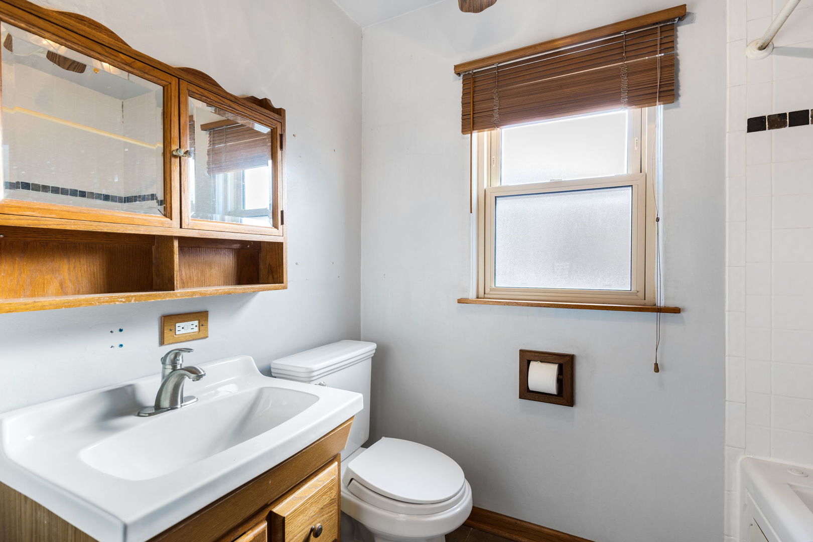 428 Callan Avenue Evanston, IL 60202 - Photo 11 of 21 a bathroom with a sink a toilet and mirror