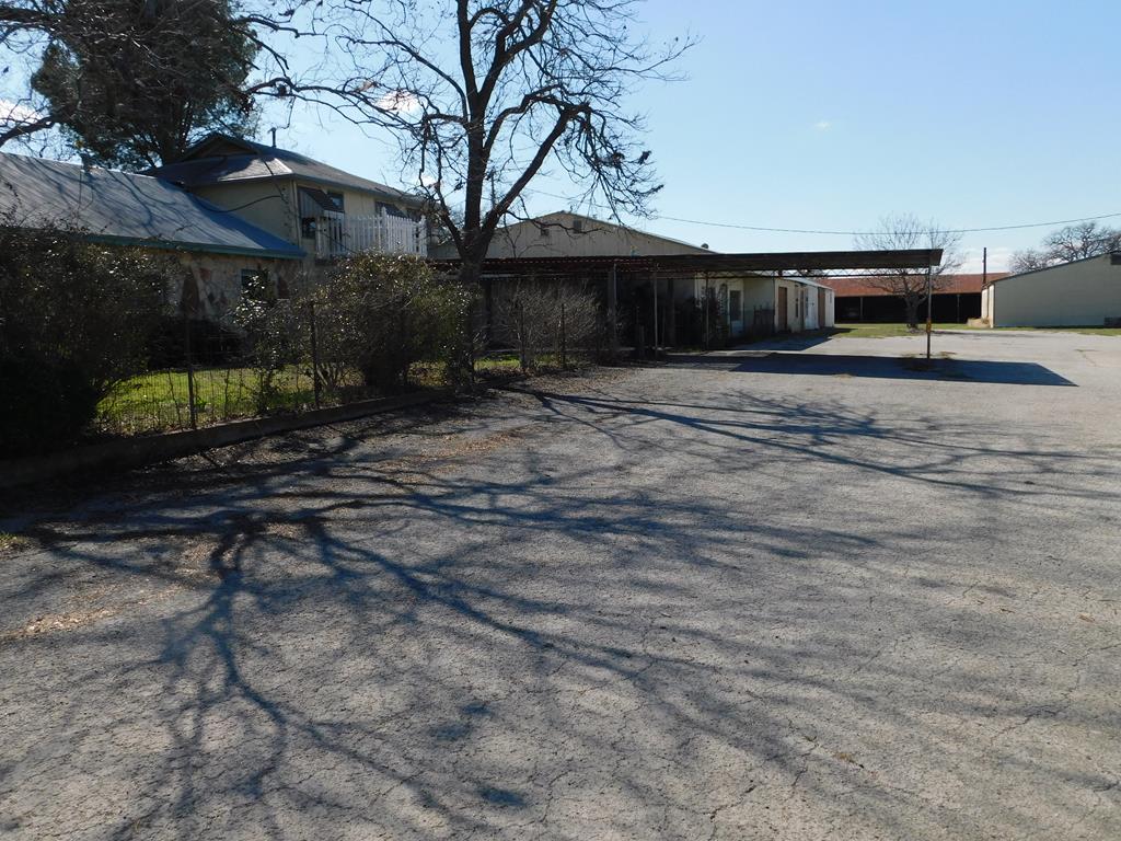 131 Elberta Street Stonewall, TX 78671 - Photo 1 of 4 a front view of a house with a yard