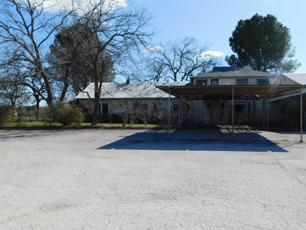 131 Elberta Street Stonewall, TX 78671 - Photo 2 of 4 a view of a house with a yard