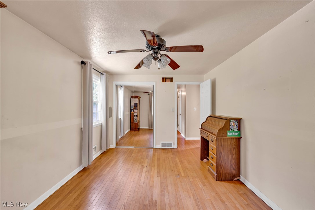 1583 Vermilion Road Vermilion, OH 44089 - Photo 19 of 41 Bedroom with hardwood floors and sliding closet doors