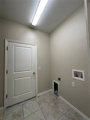 a view of a big room with an outdoor view and a window