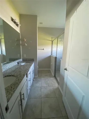 a bathroom with a shower and toilet