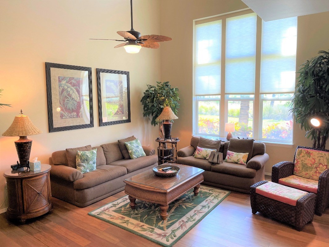 a living room with furniture and a large window