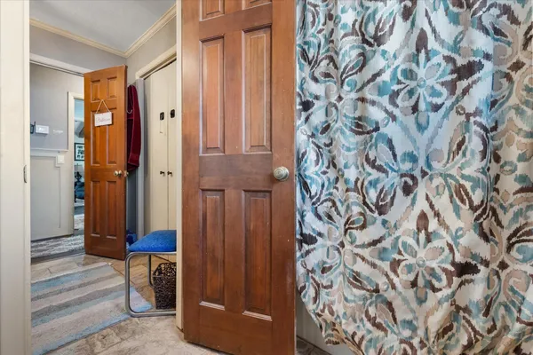 a bathroom with a shower and a sink