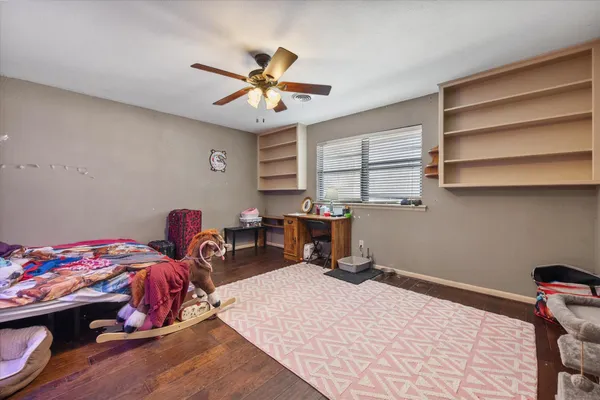 a bedroom with furniture and a window