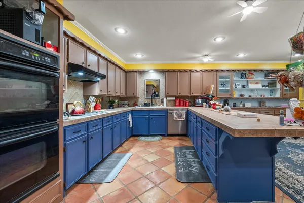 a kitchen with a sink and cabinets