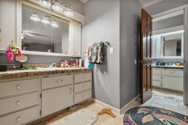 a bathroom with a sink and a mirror