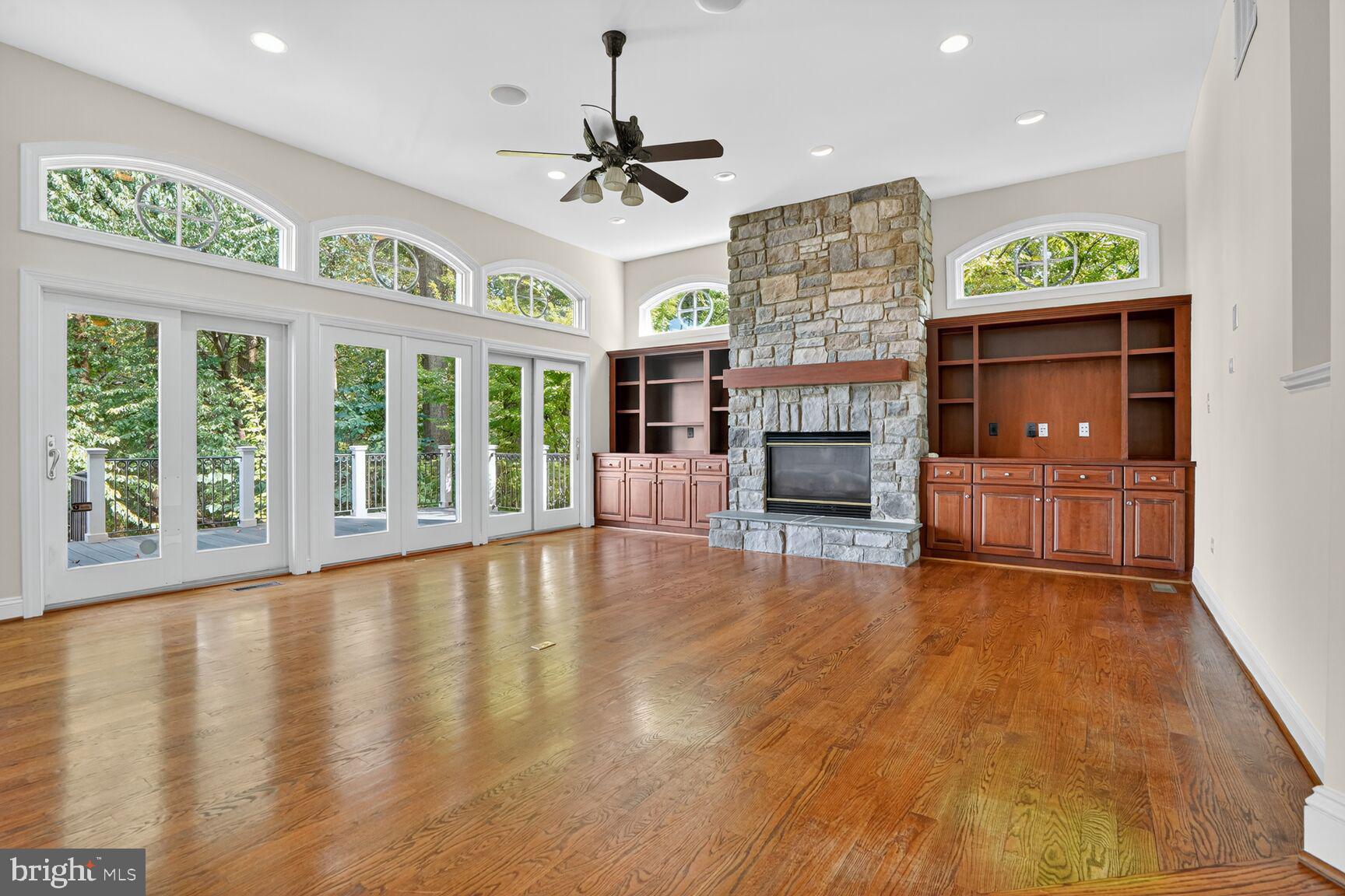 3950 27th Road North Arlington, VA 22207 - Photo 29 of 86 Built-ins and stone fireplace in family room