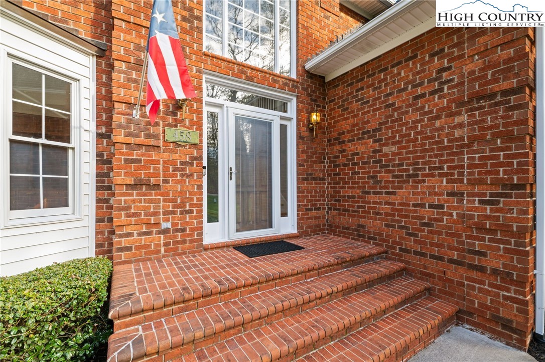 458 Jim Caudill Road Wilkesboro, NC 28697 - Photo 6 of 50 a view of a brick house with many windows
