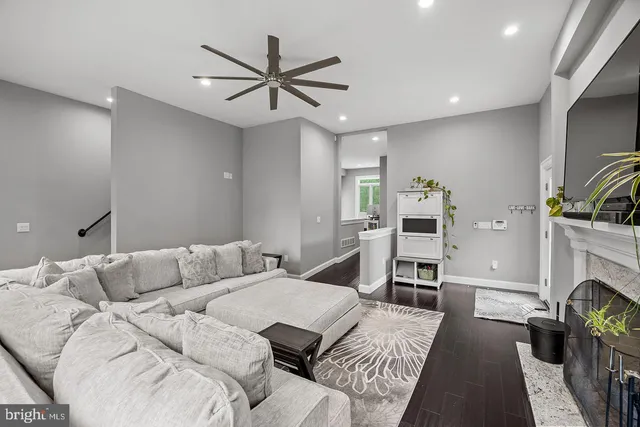 a bedroom with a bed a large window with outer view and couch