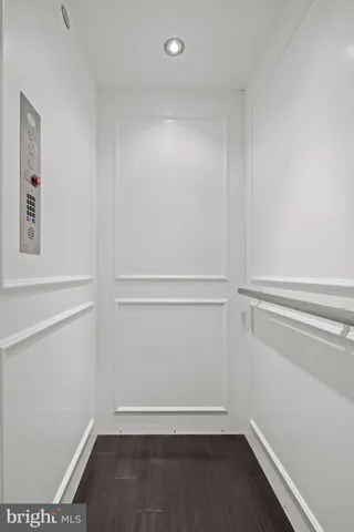 a bedroom with a bed couch and window