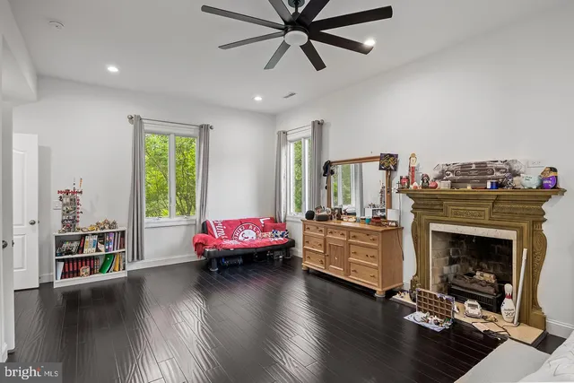 a bathroom with a granite countertop double vanity sink and mirror