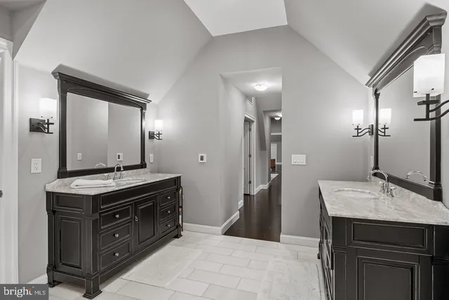 a view of a yard in front of a house with large trees