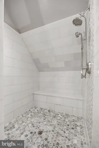 a view of a swimming pool and lounge chairs