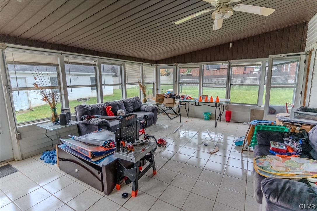 4002 Chew Street Allentown, PA 18104 - Photo 22 of 27 a living room with furniture and a floor to ceiling window