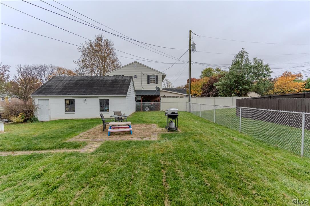 4002 Chew Street Allentown, PA 18104 - Photo 25 of 27 a front view of a house with a garden and plants