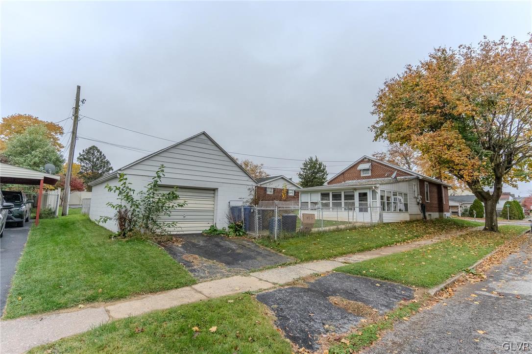 4002 Chew Street Allentown, PA 18104 - Photo 26 of 27 a front view of a house with a garden and trees