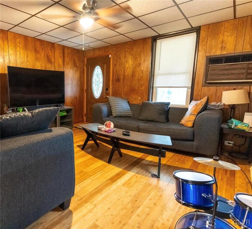 4002 Chew Street Allentown, PA 18104 - Photo 6 of 27 a living room with furniture a flat screen tv and a window