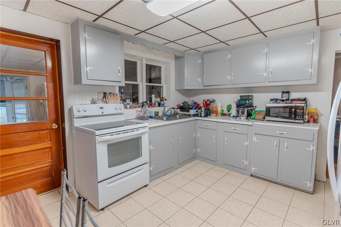 4002 Chew Street Allentown, PA 18104 - Photo 7 of 27 a kitchen with a sink cabinets and window