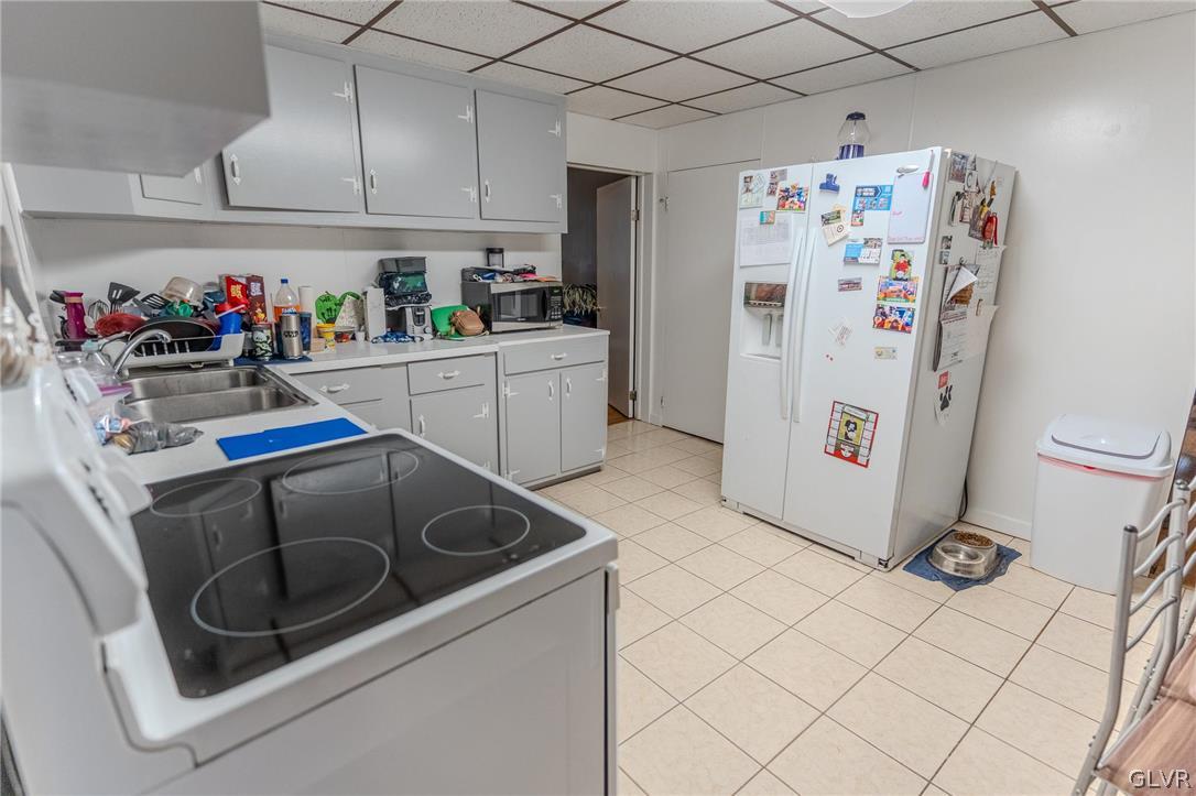 4002 Chew Street Allentown, PA 18104 - Photo 8 of 27 a kitchen with refrigerator and cabinets