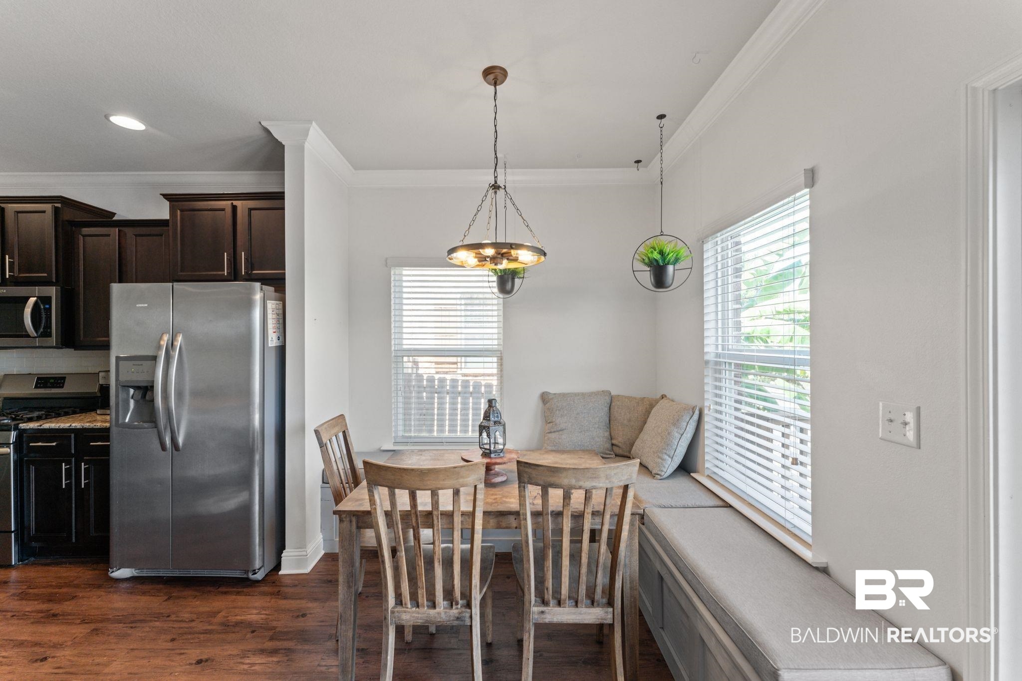 12711 Chickadee Lane Daphne, AL 36527 - Photo 13 of 39 Dining space with crown molding, dark wood-style floors, and recessed lighting
