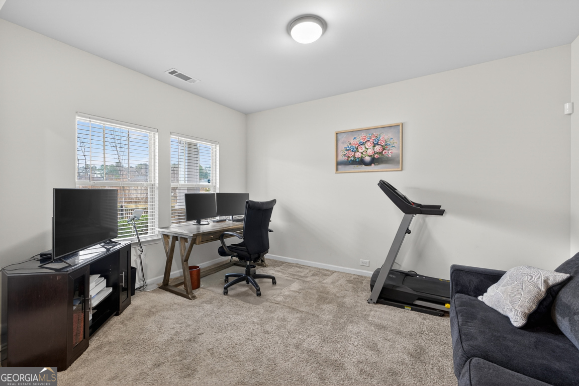 3511 Argent Way Marietta, GA 30008 - Photo 17 of 56 a view of a workspace with furniture and a flat screen tv