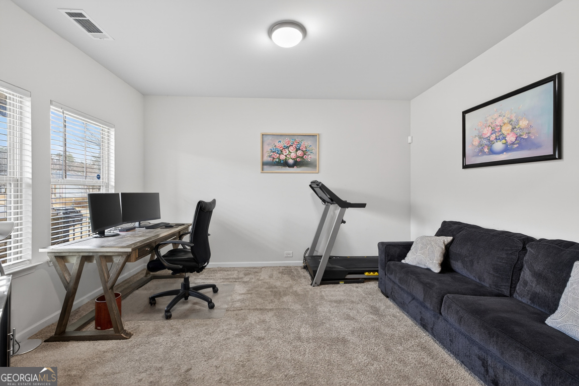 3511 Argent Way Marietta, GA 30008 - Photo 18 of 56 a view of a workspace with a couch and a window