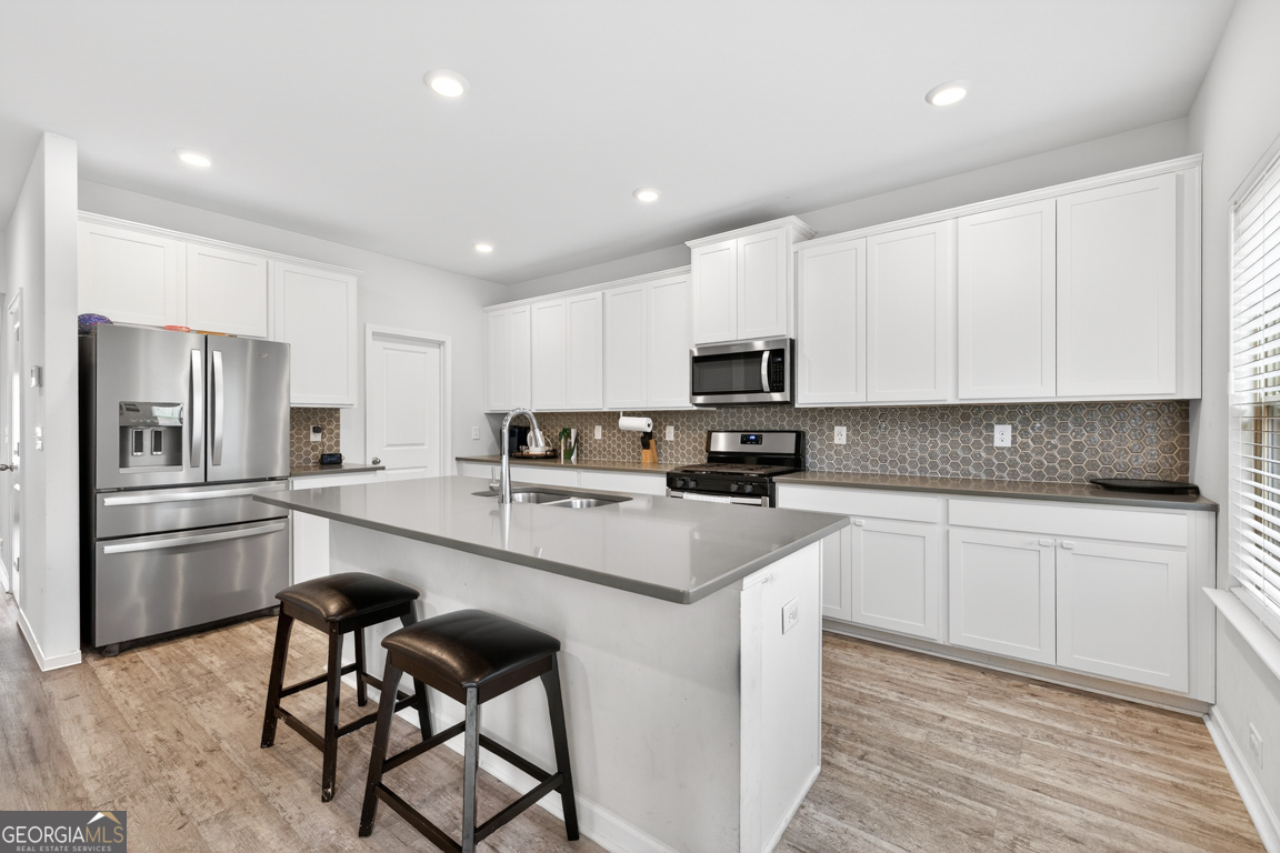 3511 Argent Way Marietta, GA 30008 - Photo 24 of 56 a kitchen with stainless steel appliances granite countertop a refrigerator and microwave